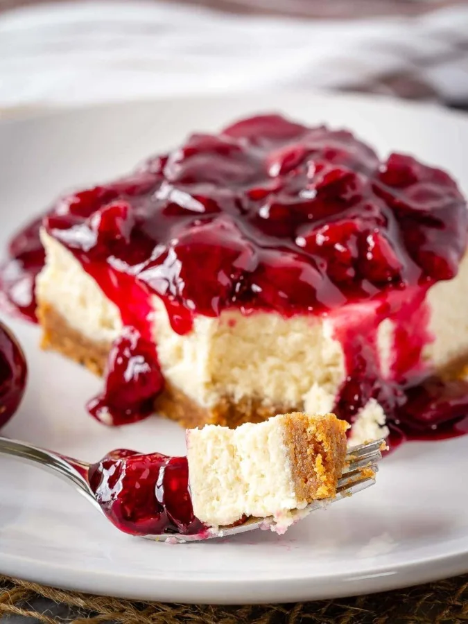 These easy cherry cheesecake bars make the perfect summer dessert - decadent cheesecake topped with a fresh cherry sauce!