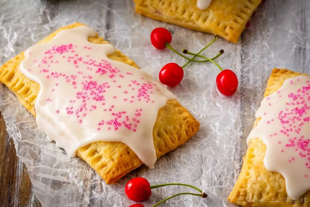 These cherry pop tarts are easy to make, and make the best dessert or snack. Flaky homemade pastry wrapped around a sweet cherry filling - so good!