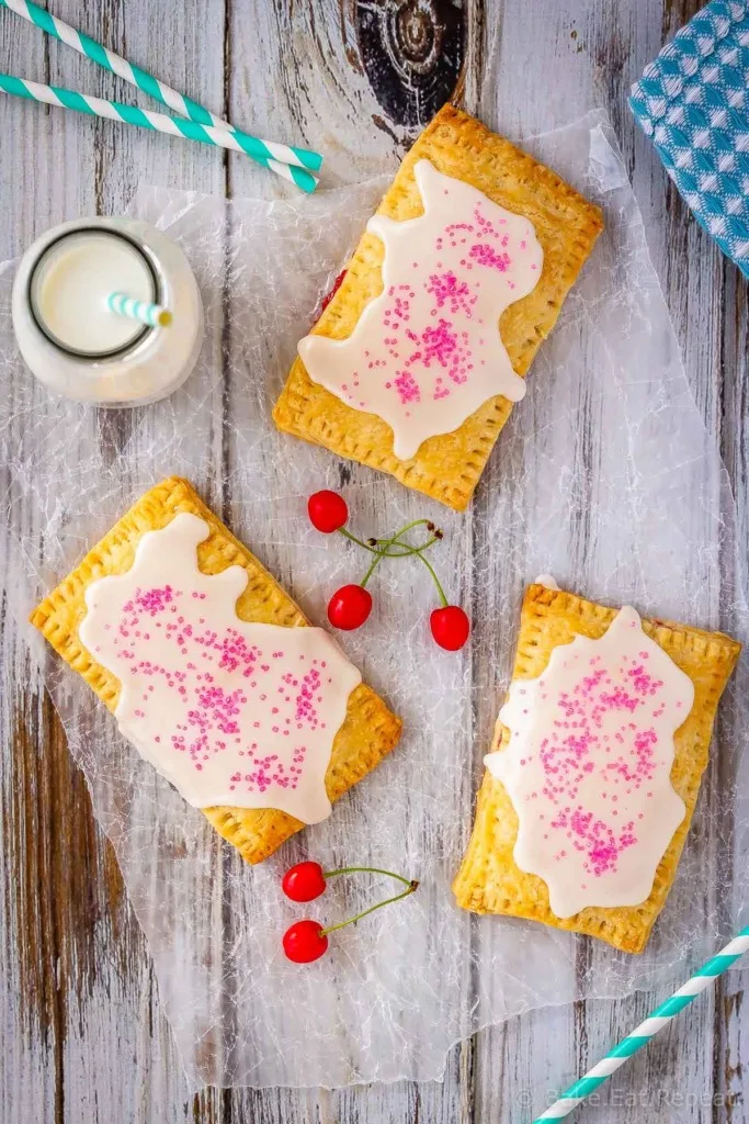 These cherry pop tarts are easy to make, and make the best dessert or snack. Flaky homemade pastry wrapped around a sweet cherry filling - so good!