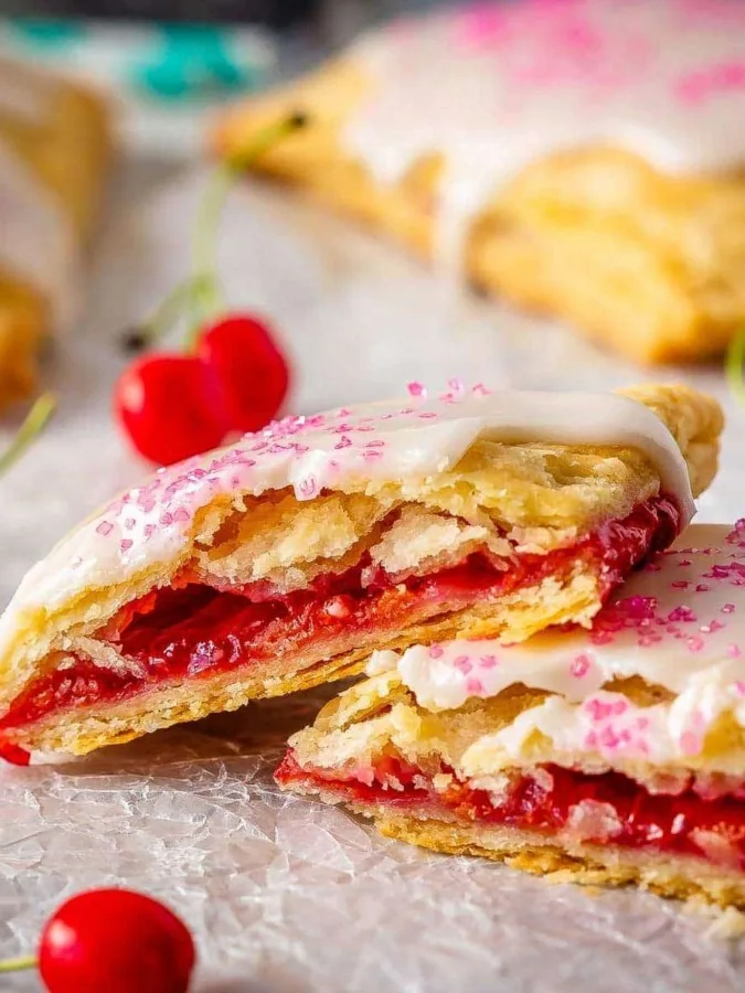 These cherry pop tarts are easy to make, and make the best dessert or snack. Flaky homemade pastry wrapped around a sweet cherry filling - so good!