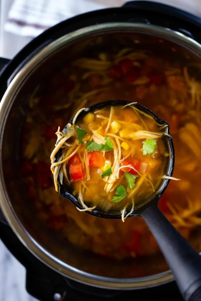 This Instant Pot chicken taco soup is so fast and easy to make and everyone loves it! It's one of our favourite meals - just throw everything in the Instant Pot, hit start, and dinner is ready in half an hour!