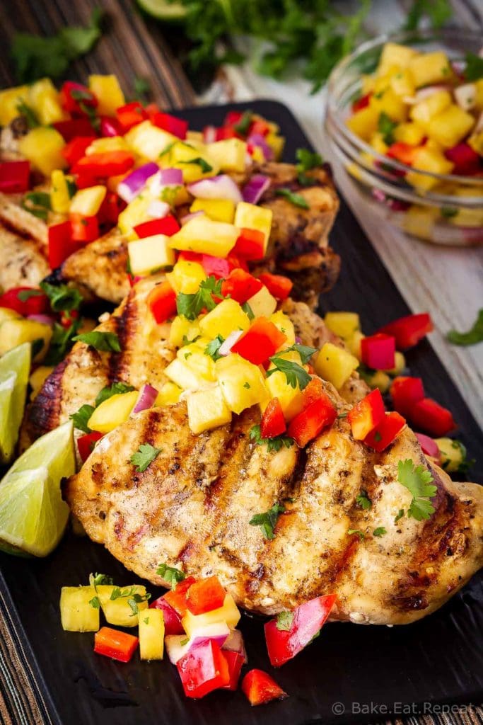 This lemon garlic grilled chicken with pineapple salsa is quick and easy to make and is the perfect summer meal! Juicy grilled chicken with fruit salsa!