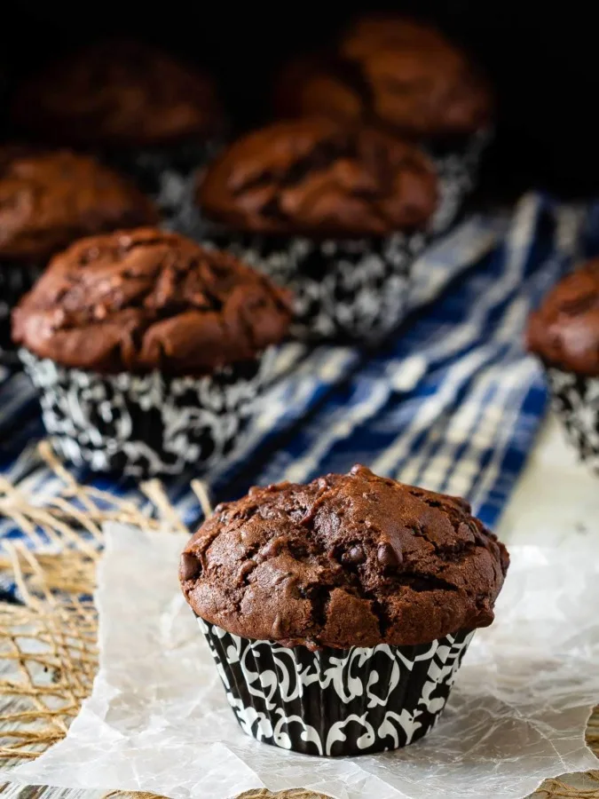 These chocolate zucchini muffins are a great way to use up all that garden zucchini! Moist, chocolatey, delicious muffins that everyone will love!