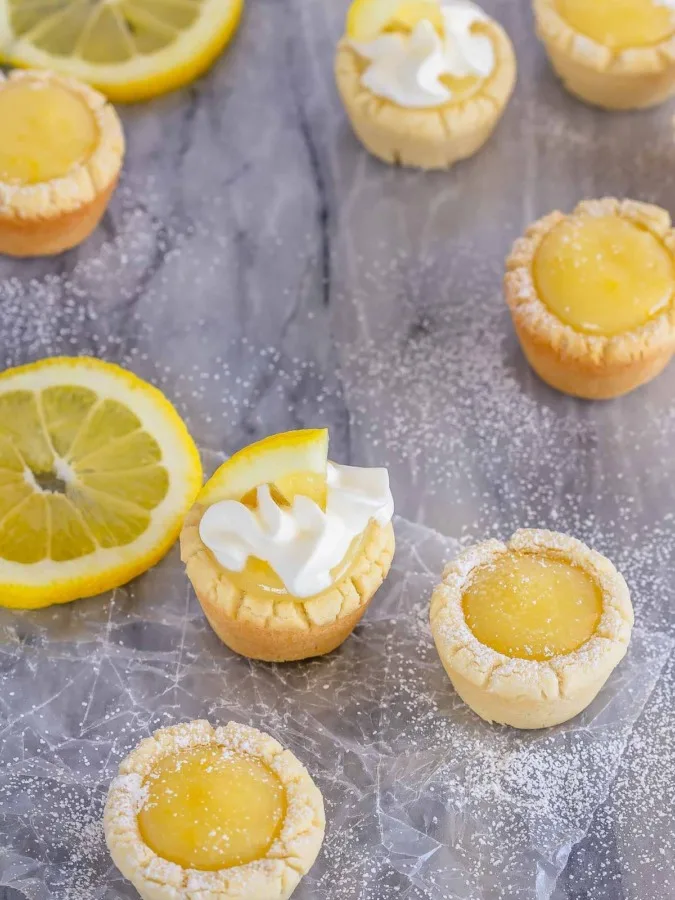 These lemon sugar cookie cups are like mini lemon pies with a sugar cookie crust - easy to make, they're the perfect little sweet treat!