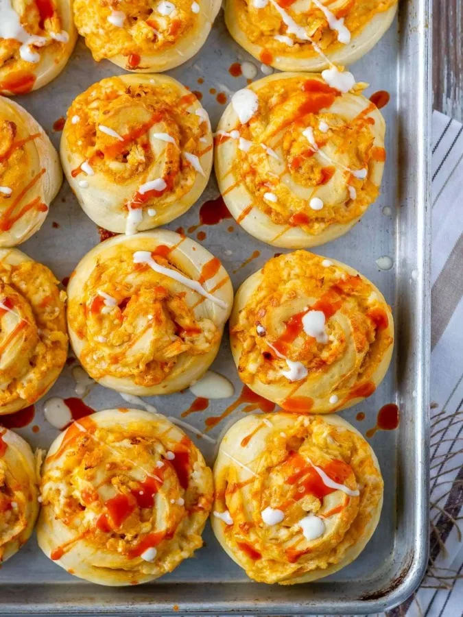 This buffalo chicken pizza rolls recipe is so easy to make. It's the perfect easy dinner, game day snack, or make ahead lunch!