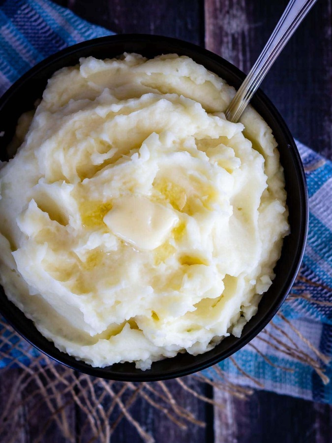 Creamy Instant Pot mashed potatoes are so fast and easy to make, and can even be made ahead of time - the perfect side dish for Thanksgiving!