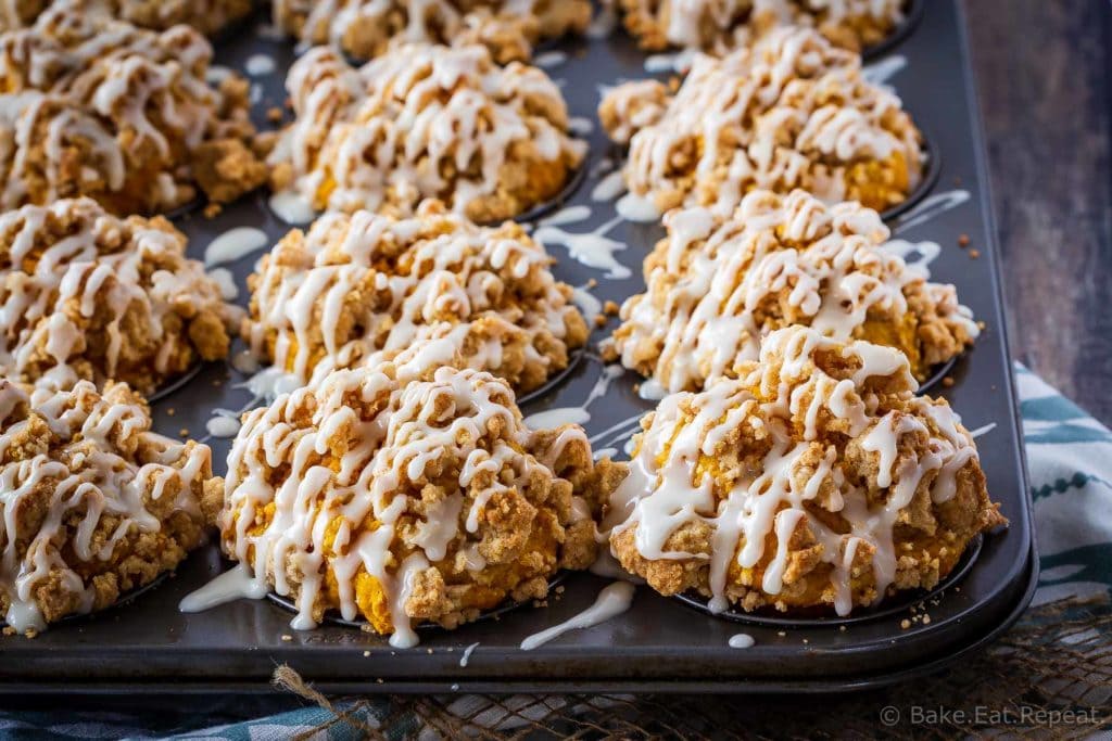 These bakery style pumpkin spice muffins are delicious on their own - but add that crumb topping and drizzle them with a maple glaze and they're amazing!