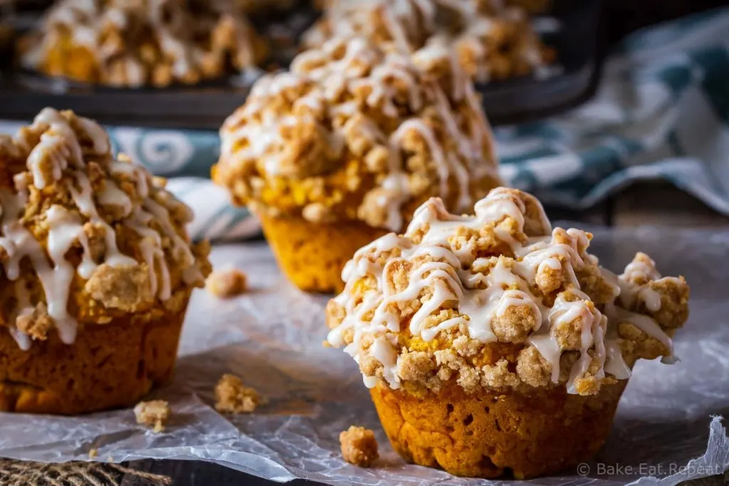 These bakery style pumpkin spice muffins are delicious on their own - but add that crumb topping and drizzle them with a maple glaze and they're amazing!