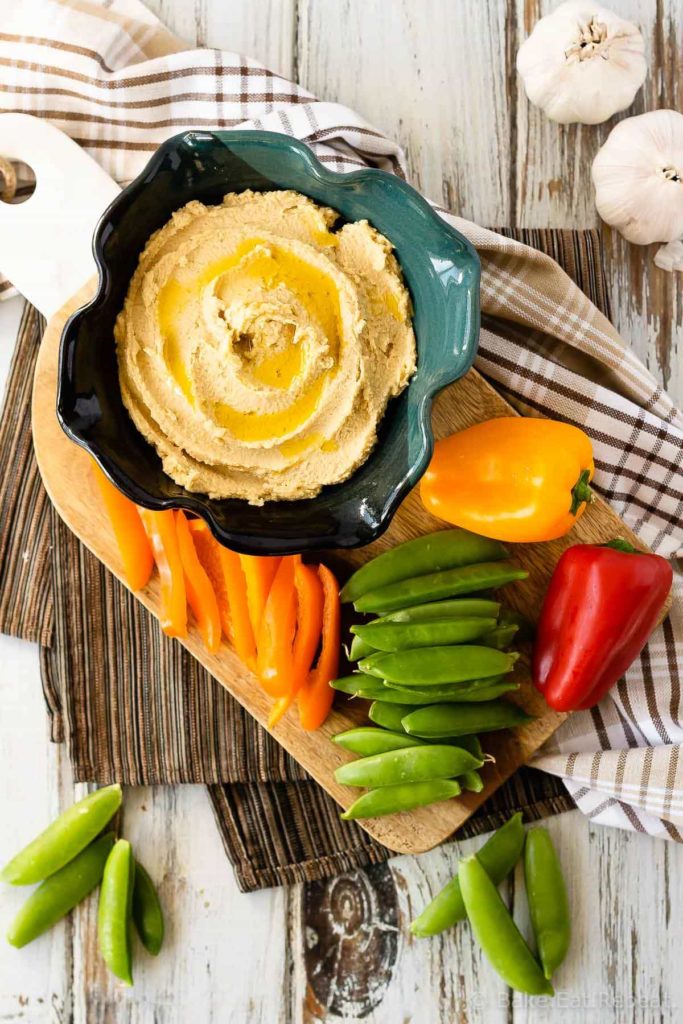 This easy roasted garlic hummus is silky smooth and full of roasted garlic flavour. Quick and easy to make, this homemade hummus is the perfect snack!
