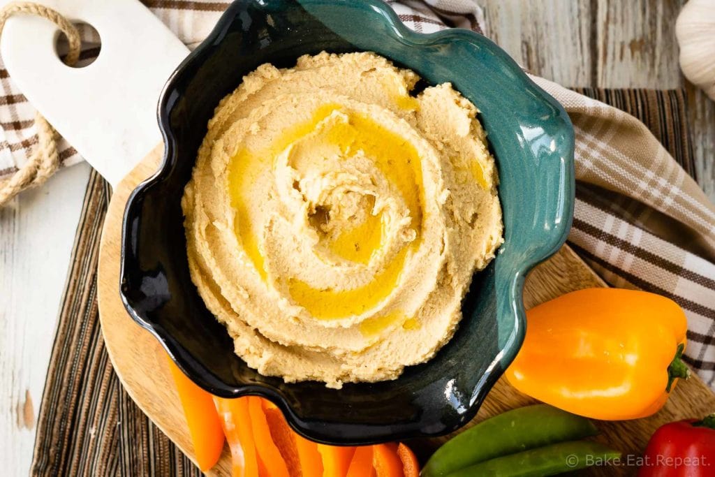 This easy roasted garlic hummus is silky smooth and full of roasted garlic flavour. Quick and easy to make, this homemade hummus is the perfect snack!