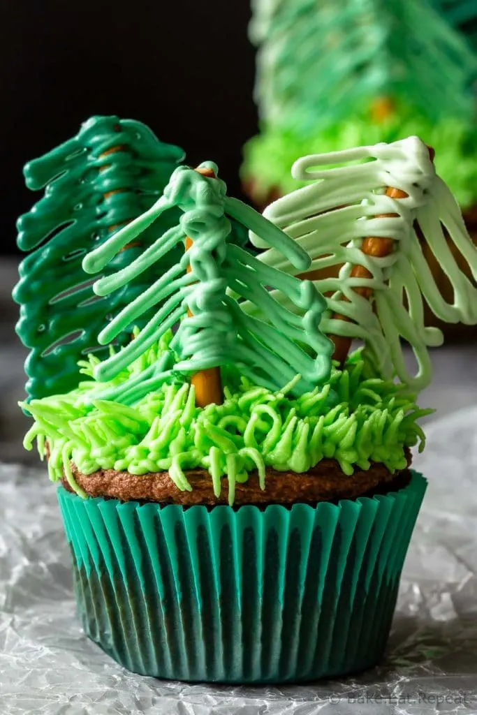 Forest cupcakes with tree toppers made from pretzels and candy melts