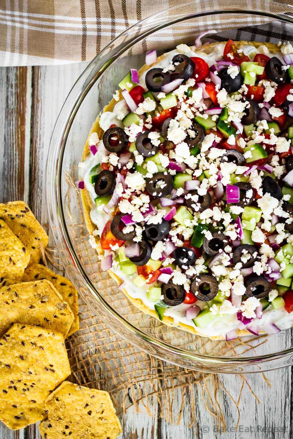 Greek 7 Layer Dip - Bake. Eat. Repeat.