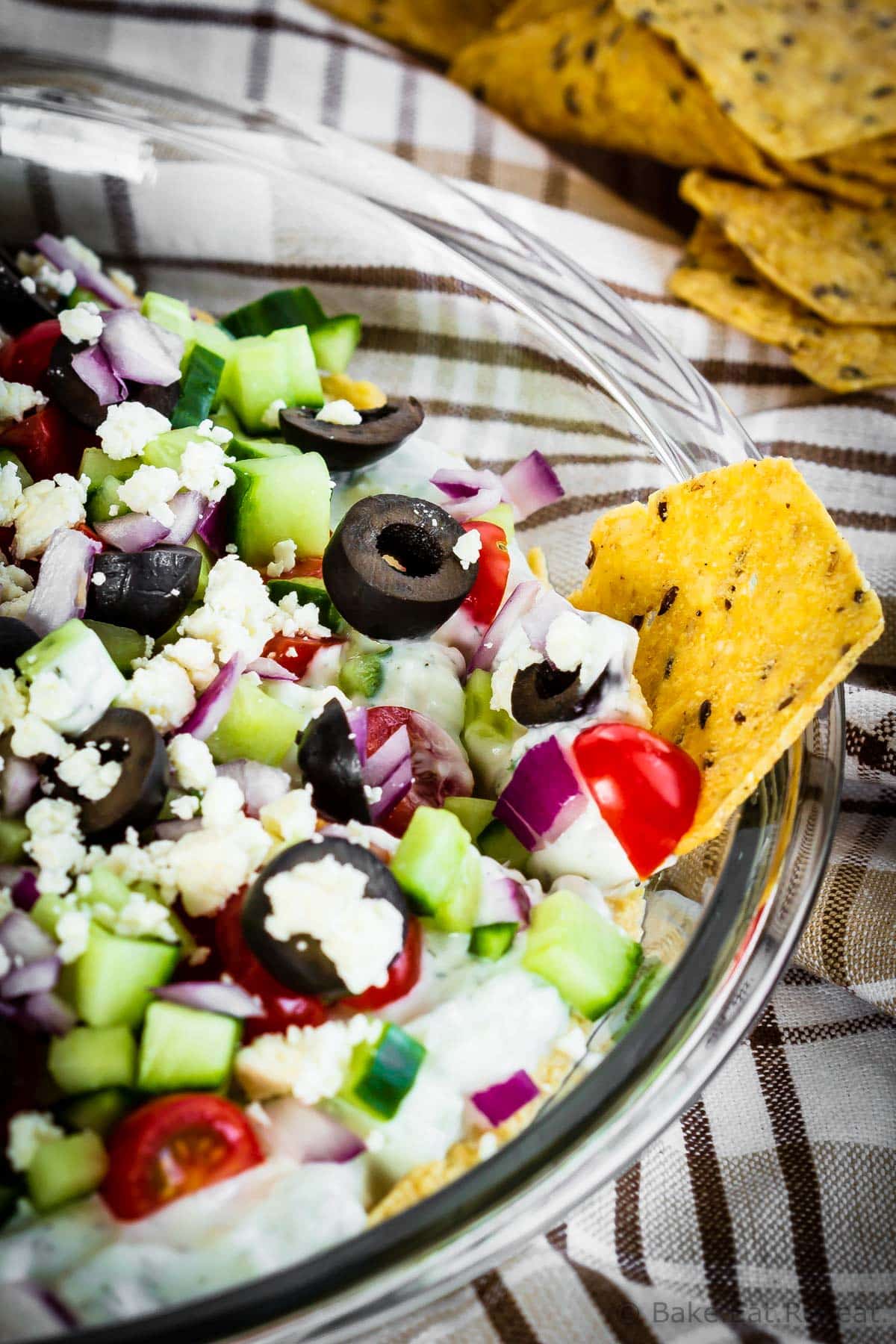 Greek 7 Layer Dip - Bake. Eat. Repeat.