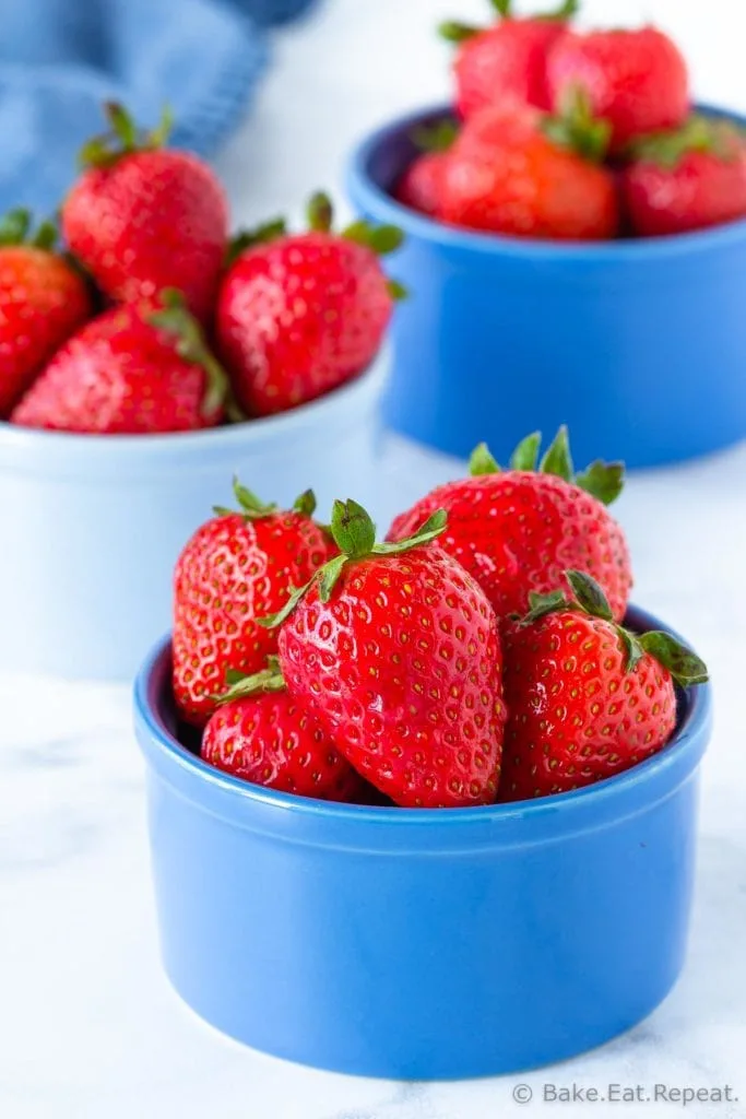 A serving of strawberries in bowls