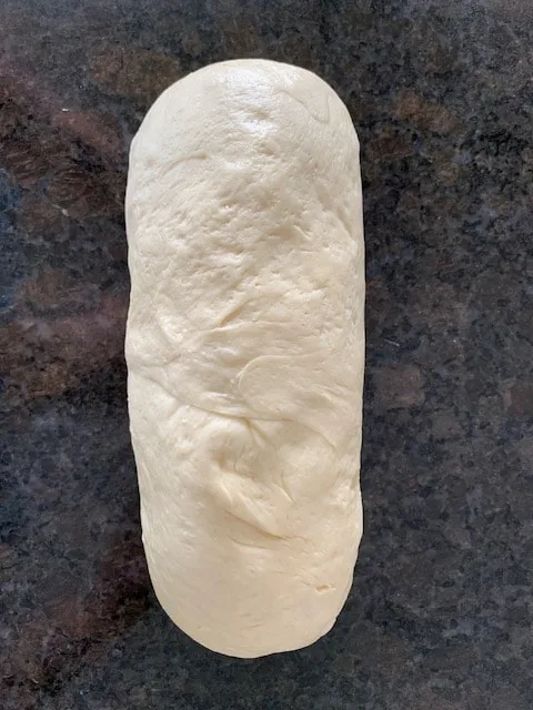 Bread dough shaped into a loaf.