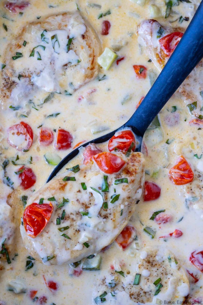 skillet chicken in a garlic cream sauce with tomatoes, basil and zucchini