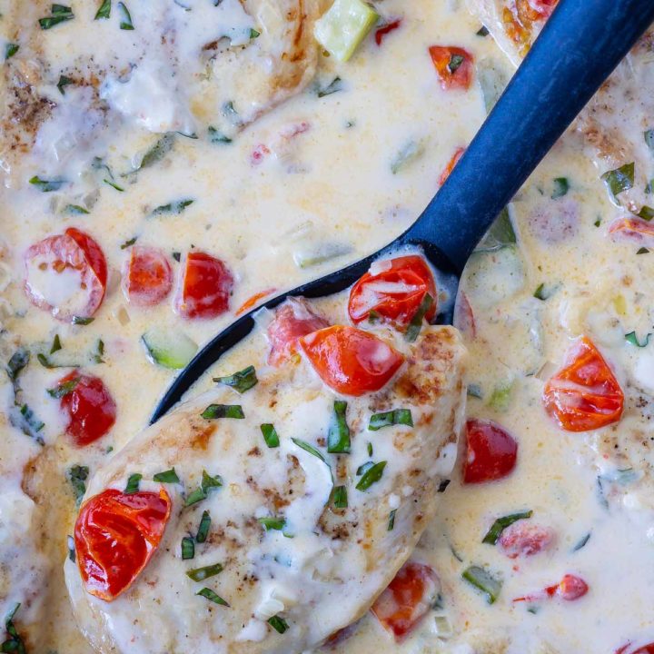 skillet chicken in a garlic cream sauce with tomatoes, basil and zucchini