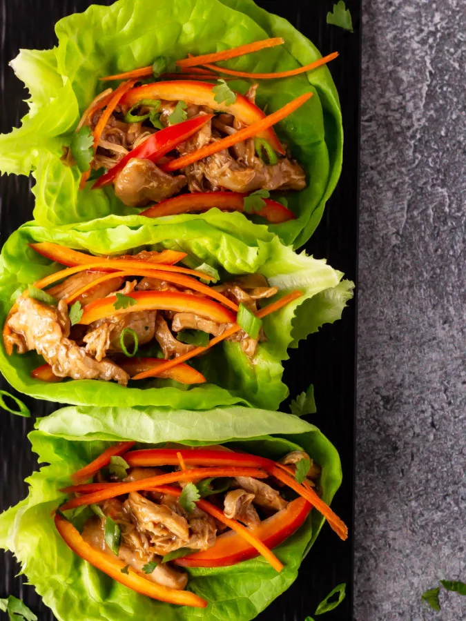 Hoisin chicken lettuce wraps on a platter.