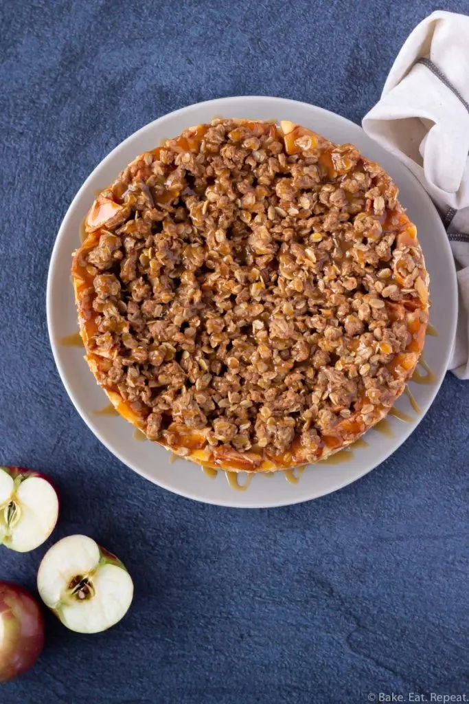 Easy to make apple crisp cheesecake with caramel sauce.