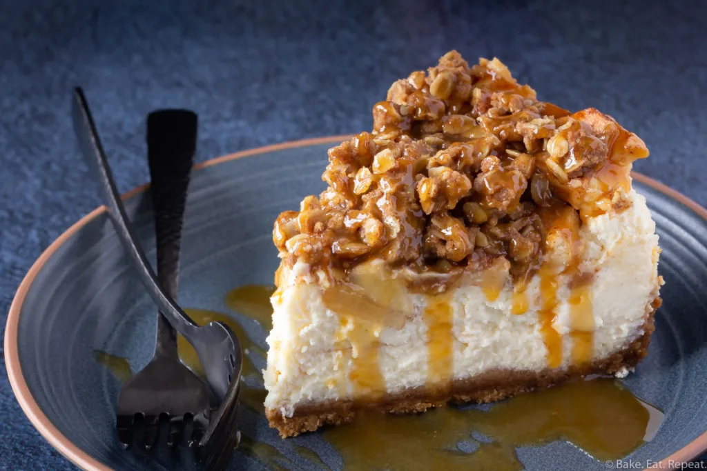 Easy vanilla cheesecake with an apple crisp topping and caramel sauce.