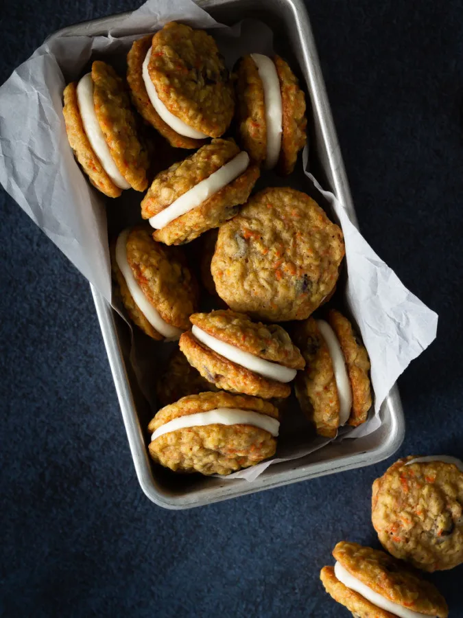 carrot oatmeal raisin sandwich cookies with cream cheese frosting