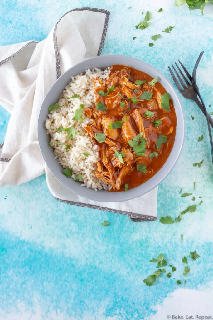 A bowl of Indian butter chicken and rice.
