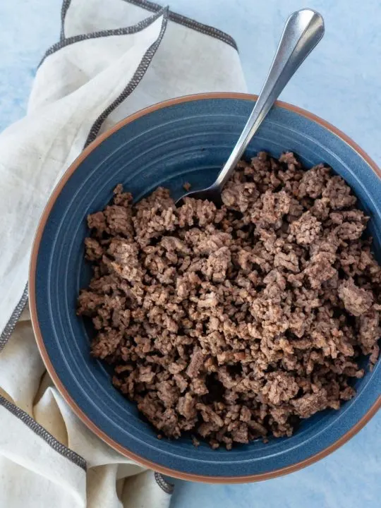 Cooked ground beef in a bowl after cooking from frozen in the Instant Pot.