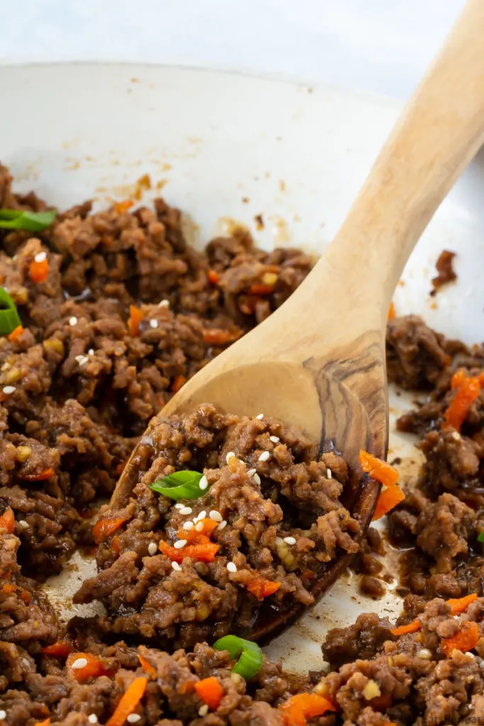 Korean ground beef with a spoon in a skillet.