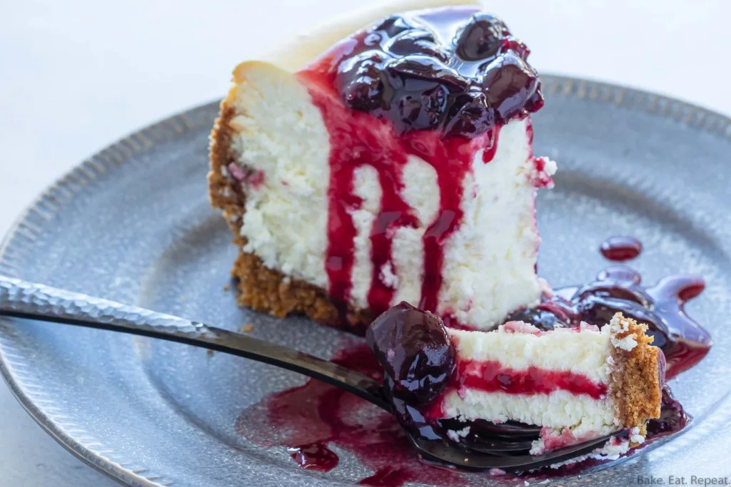 homemade cheesecake with fresh cherry sauce