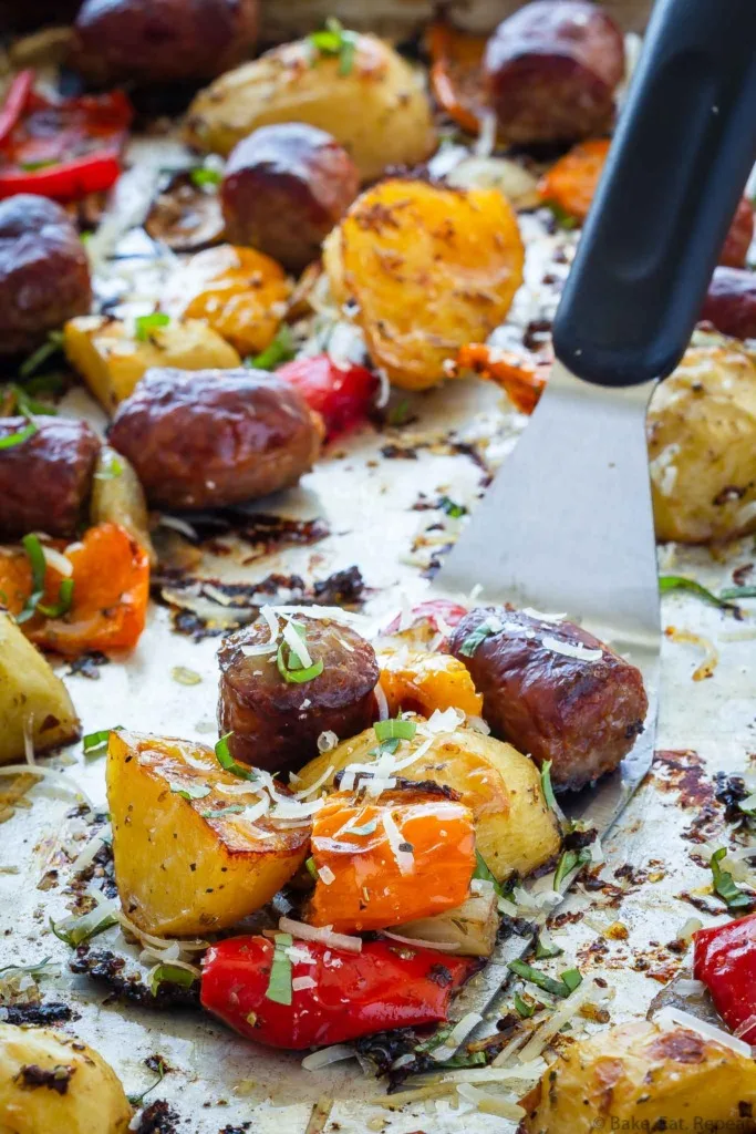 Italian sausage, peppers, potatoes, and onions baked on a sheet pan