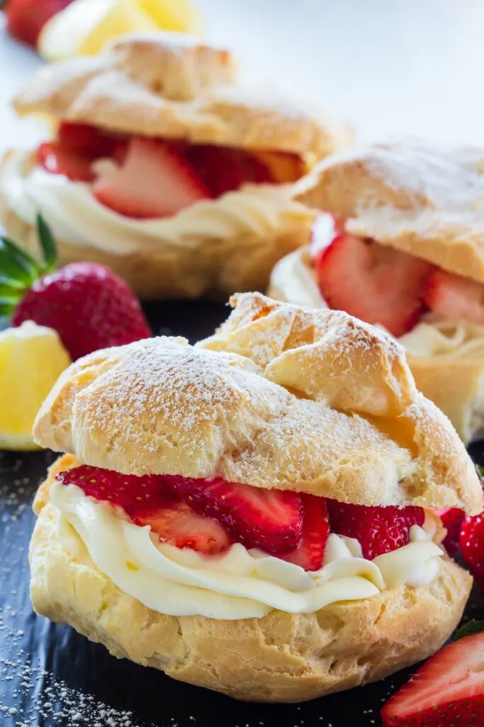 easy cream puffs filled with lemon curd, lemon cream, and fresh strawberries